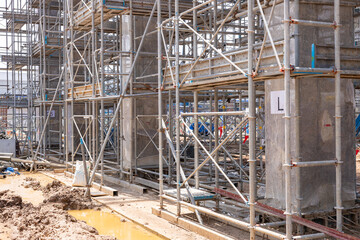 High scaffolding structure under construction beams