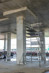 Scaffolding and steel structure on muddy construction site