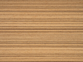Naklejka premium Teak veneer with its natural horizontal stripes in earthy beige and tan offers a serene and classic look