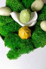 A collection of painted easter eggs celebrating a Happy Easter on a spring day with green grass with copy space.