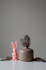 A collection of painted easter decoration celebrating a Happy Easter. Pink bunny. Copy space. 