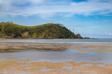 Northland, New Zealand. Whananaki Inlet entrance. Motutara Point headland, viewed from Whananaki South beach.