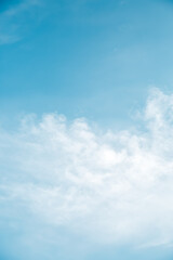 Beautiful light blue sky with fluffy clouds