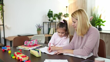 Engaging in creative learning at home with a parent and child during afternoon study time