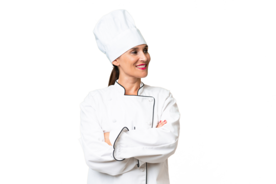 Middle-aged chef woman over isolated background looking side