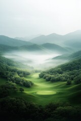 Beautiful misty morning over a lush green golf course nestled in the mountains