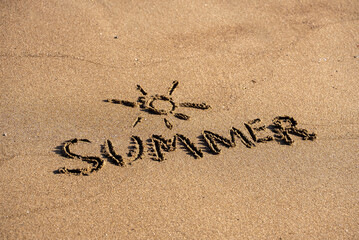 Sand on beach with text summer and sun. Holiday concept.
