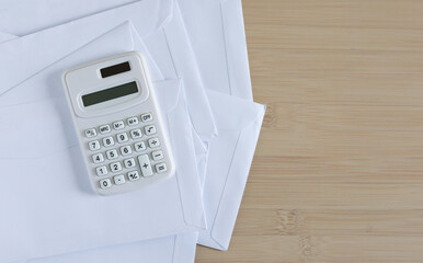 close up top view on calculator and open over calculator and group of invoice letter mail and from...