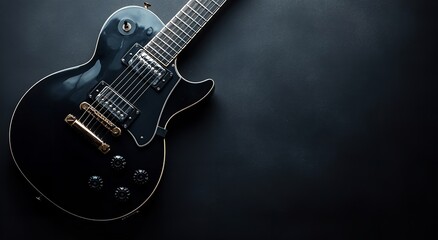 Fototapeta premium Black electric guitar on black background with copy space