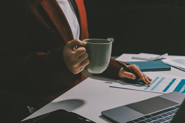 Tax deduction planning concept. Women use a calculator to calculate expenses and taxes to receive...