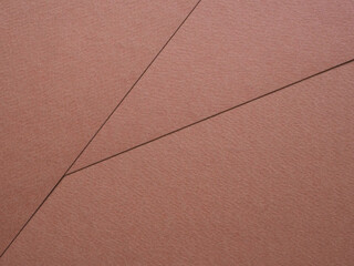 Fototapeta premium Close-up, abstract textured surface brown (mocha mousse) paper background. Geometric composition. Concept for image, text, design...