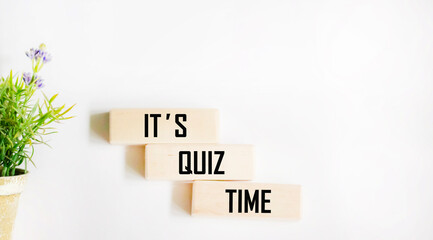 Wooden blocks with the inscription Quiz Time. The concept of answering questions or quiz games
