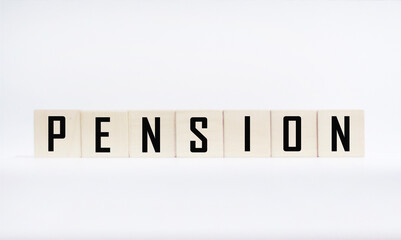 PENSION symbol. The conceptual word PENSION on wooden blocks on a white background. The concept of business and finance.