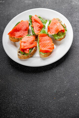 Salmon sandwich red fish seafood appetizer dish fresh tasty gourmet food background on table rustic food top view copy space 