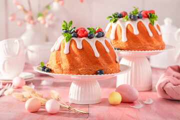 Sweet Easter ring cake with raspberries and blueberries.