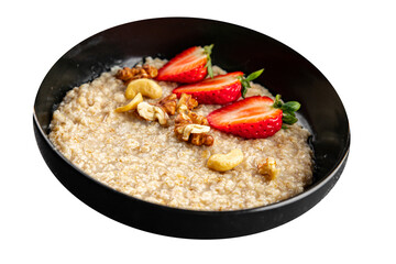 Oatmeal porridge strawberrie nuts healthy breakfast appetizer dish fresh gourmet food background on the table rustic food top view copy space 