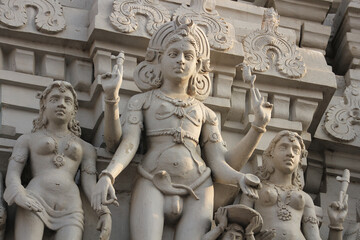 A figure of a Hindu god on the gopuram of the Annamalaiyar Temple in Tiruvannamalai, India.