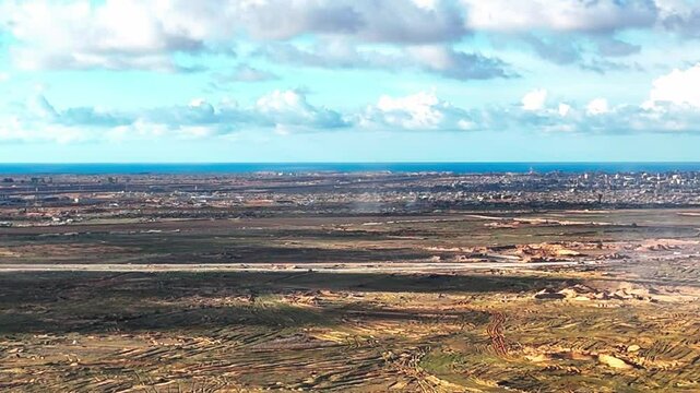 Stunning aerial view over the city of Rafah, capturing a densely populated urban landscape near the desert and borderlines. Shot with a drone in natural daylight, this image highlights the complex 