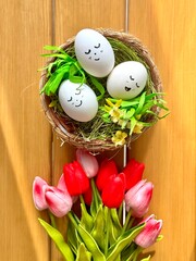 Decorative Easter basket surrounded by tulips