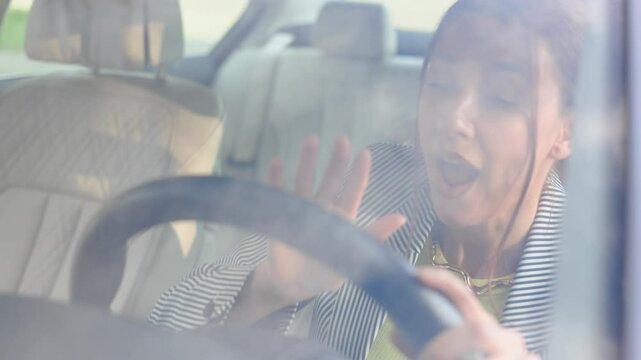 girl in business suit in car swearing at another driver or pedestrian,, waves his arms and hits the steering wheel. stress, standing in traffic jam, congested traffic