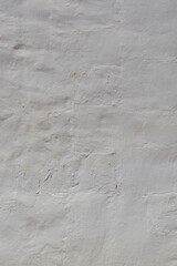 White wall with rough surface. Facade wall of a house in the Canarian architecture style