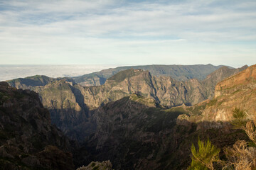 view from the Pico de Ruivo to Pico do Arieiro hike in Madeira offers a spectacular perspective of the island's rugged mountain landscape