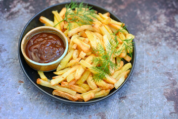  Home made   Fresh fried French fries  in a bowl on wooden rustic  background