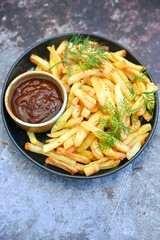  Home made   Fresh fried French fries  in a bowl on wooden rustic  background