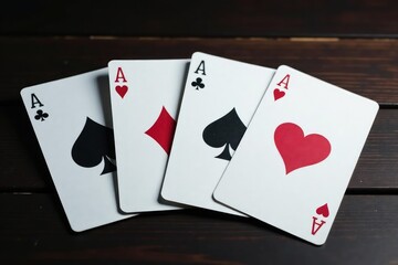 Obraz premium Playing cards arranged in a row showing the four aces , card game, casino, arrangement