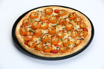 Varied pizzas on black plates with diverse toppings on a white background