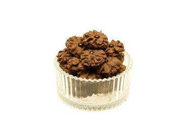 Kue Semprit Coklat or Chocolate Butter Cookies is a Traditional Indonesian Cookies for Ied Al Fitr served on crystal bowl, isolated on white background
