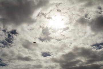 A vast plain beneath a clouded sky, where the soft, overcast clouds stretch across the sky,...