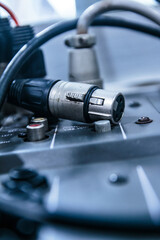 XLR cables that transmit audio signals to conference rooms