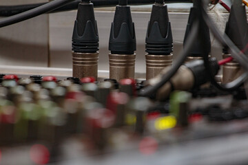 XLR cables that transmit audio signals to conference rooms