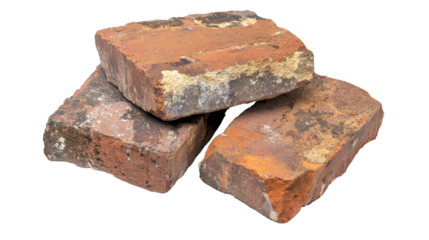 A detailed view of old bricks isolated on white, focusing on their chipped edges, faded color, and textured surface that tells a story of age and history.