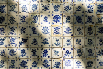 Azulejos adorning the walls of a garden in Funchal, Madeira, featuring intricate and colorful...