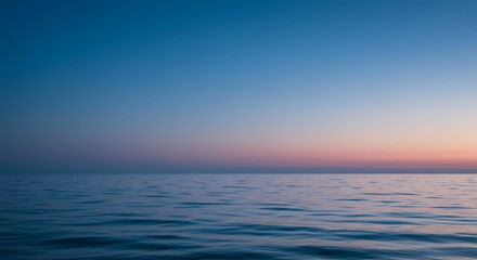 Obraz premium Calm Ocean Water at Dusk with Beautiful Sky Gradient