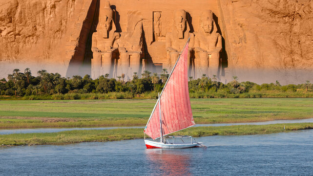 Beautiful Nile scenery with sailboat in the Nile on the way to The Front of the Abu Simbel Temple - Egypt, Africa