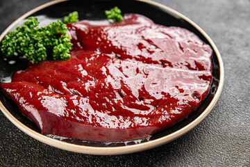 Raw liver beef veal meat steak liver grill appetizer dish fresh gourmet food background on the table rustic food top view copy space keto and paleo diet