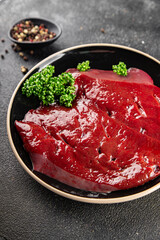 Raw liver beef veal meat steak liver grill appetizer dish fresh gourmet food background on the table rustic food top view copy space keto and paleo diet