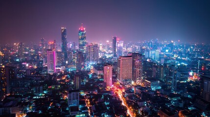 Obraz premium Night Lights of Bangkok Skyline: A Vibrant Metropolis at Night