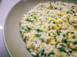 Background with risotto with spring green herbs