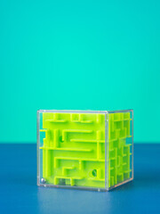 Close-up of a volumetric green cube maze on a blue background