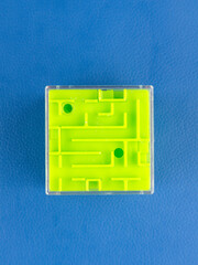 Close-up of a volumetric green cube maze on a blue background