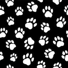 Fototapeta premium Pattern with white paw prints of a dog, cat on a black background in grunge style. Drawn with brush strokes, splashes, blots.