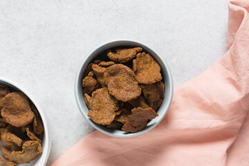 Overhead view of kuli-kuli on a plate, top view of nigerian groundnut cakes on a plate, fresh homemade nigerian kulikuli on a ceramic plate