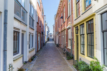 Narrow street with old houses in Gorinchem, Netherlands
