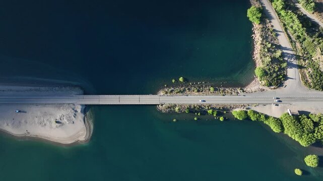 Aerial top view o bridge over the Traful River with cars passing bay. Neuquen, Argentina