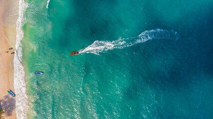 
Koh Phangan, Thailand - December 29, 2024: Beautiful aerial view of Haad Rin Beach with turquoise water, boats