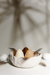 Beige Happy Easter composition with eggs on a spring day. Copy space.